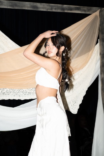 Mischa in the white look against draped chiffon and lace